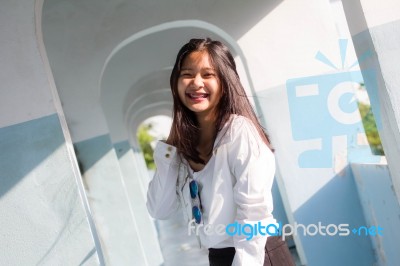 Portrait Of Thai Student Teen Beautiful Girl Relax And Smile Stock Photo