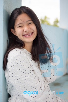 Portrait Of Thai Student Teen Beautiful Girl Relax And Smile Stock Photo