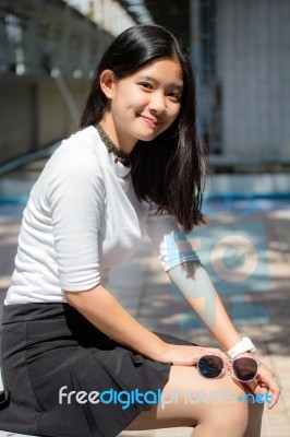 Portrait Of Thai Student Teen Beautiful Girl Relax And Smile Stock Photo