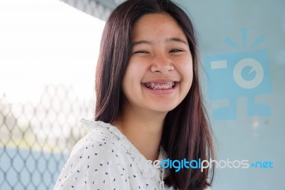 Portrait Of Thai Student Teen Beautiful Girl Relax And Smile Stock Photo