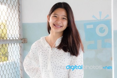 Portrait Of Thai Student Teen Beautiful Girl Relax And Smile Stock Photo