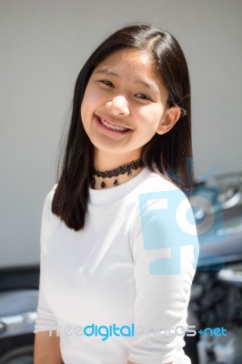 Portrait Of Thai Student Teen Beautiful Girl Relax And Smile Stock Photo