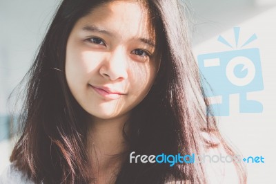 Portrait Of Thai Student Teen Beautiful Girl Relax And Smile Stock Photo