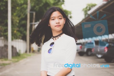 Portrait Of Thai Student Teen Beautiful Girl Relax And Smile Stock Photo