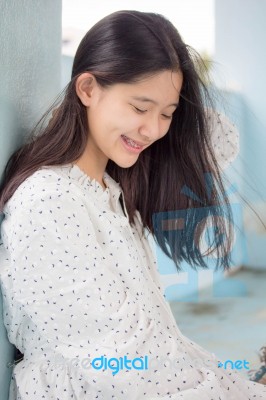 Portrait Of Thai Student Teen Beautiful Girl Relax And Smile Stock Photo