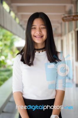 Portrait Of Thai Student Teen Beautiful Girl Relax And Smile Stock Photo