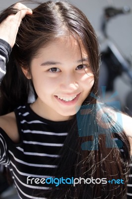 Portrait Of Thai Student Teen Beautiful Girl Relax And Smile Stock Photo