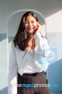 Portrait Of Thai Student Teen Beautiful Girl Relax And Smile Stock Photo