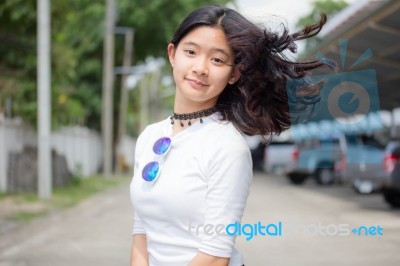 Portrait Of Thai Student Teen Beautiful Girl Relax And Smile Stock Photo