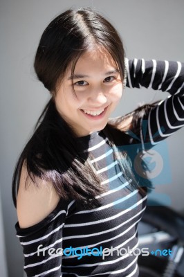 Portrait Of Thai Student Teen Beautiful Girl Relax And Smile Stock Photo