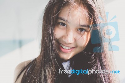 Portrait Of Thai Student Teen Beautiful Girl Relax And Smile Stock Photo