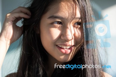 Portrait Of Thai Student Teen Beautiful Girl Relax And Smile Stock Photo