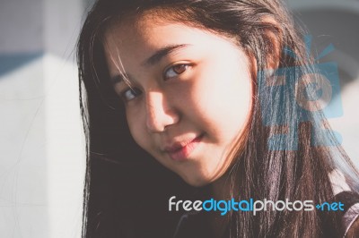 Portrait Of Thai Student Teen Beautiful Girl Relax And Smile Stock Photo