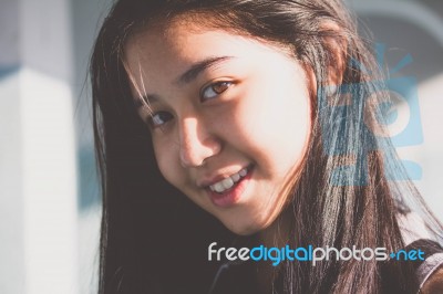 Portrait Of Thai Student Teen Beautiful Girl Relax And Smile Stock Photo