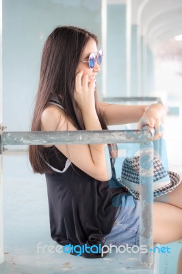 Portrait Of Thai Teen Beautiful Girl Calling Smart Phone Stock Photo