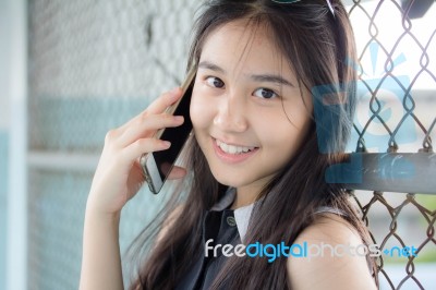 Portrait Of Thai Teen Beautiful Girl Calling Smart Phone Stock Photo
