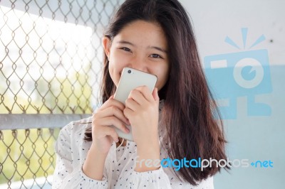 Portrait Of Thai Teen Beautiful Girl Calling Smart Phone Stock Photo