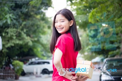 Portrait Of Thai Teen Beautiful Girl In Chinese Dress, Happy New Year And Open Box Gift, Smile And Very Happy Stock Photo