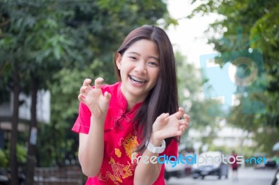 Portrait Of Thai Teen Beautiful Girl In Chinese Dress, Relax And Smile Stock Photo