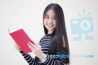 Portrait Of Thai Teen Beautiful Girl Reading Book Stock Photo