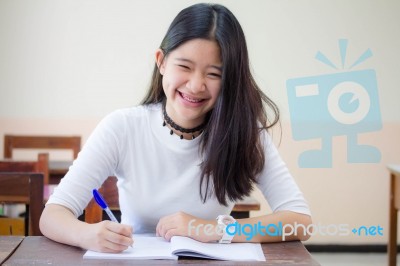 Portrait Of Thai Teen Beautiful Girl Writing Book Stock Photo