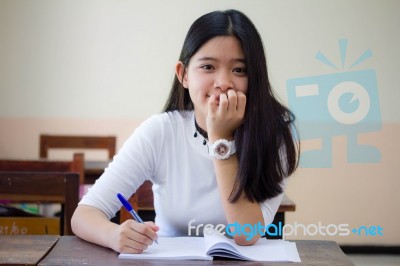 Portrait Of Thai Teen Beautiful Girl Writing Book Stock Photo