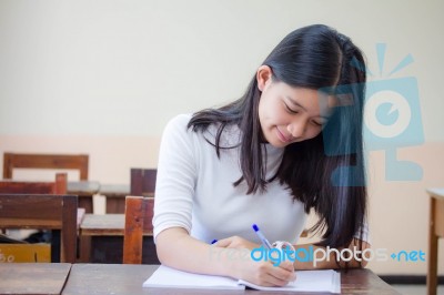 Portrait Of Thai Teen Beautiful Girl Writing Book Stock Photo