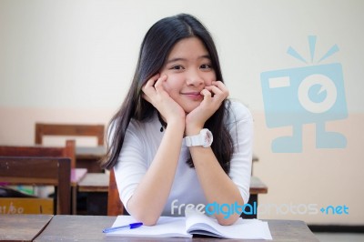 Portrait Of Thai Teen Beautiful Girl Writing Book Stock Photo