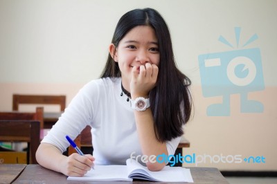 Portrait Of Thai Teen Beautiful Girl Writing Book Stock Photo