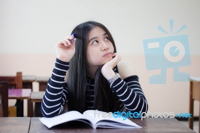 Portrait Of Thai Teen Beautiful Girl Writing Book Stock Photo