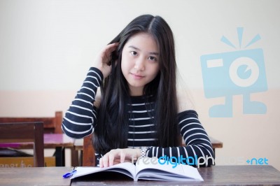 Portrait Of Thai Teen Beautiful Girl Writing Book Stock Photo