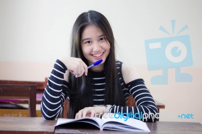 Portrait Of Thai Teen Beautiful Girl Writing Book Stock Photo