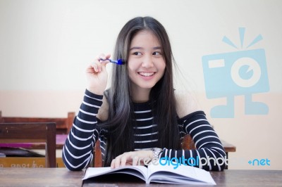 Portrait Of Thai Teen Beautiful Girl Writing Book Stock Photo