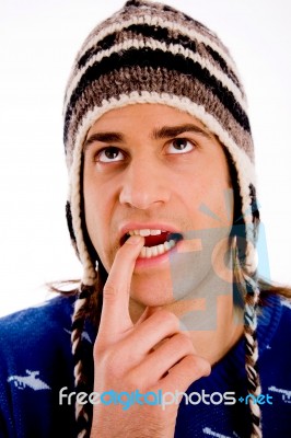 Portrait Of Thinking Man Wearing Woollen Cap Stock Photo