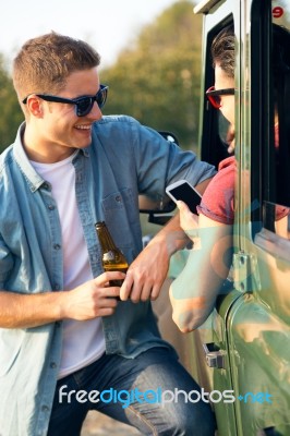 Portrait Of Two Friends Talking And Laughing In The Car Stock Photo