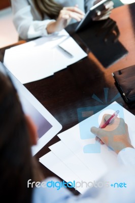 Portrait Of Two Pretty Business Women Working In The Office Stock Photo