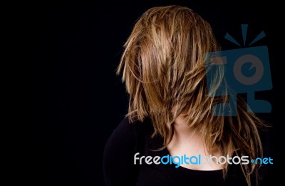 Portrait Of Woman Hiding Her Face With Hair Stock Photo