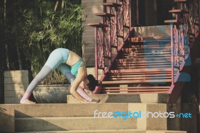 Portrait Of   Woman Playing Yoga At Home Garden Stock Photo