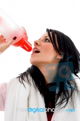 Portrait Of Woman Taking Refreshment On White Background Stock Photo