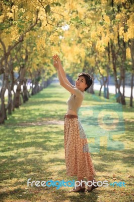 Portrait Of Young Beautiful Asian Woman Relaxing Emotion In Yell… Stock Photo