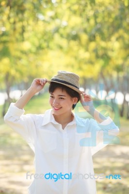 Portrait Of Young Beautiful Asian Woman Wearing Straw Hat With S… Stock Photo