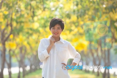 Portrait Of Young Beautiful Asian Woman With White Shirt Standin… Stock Photo