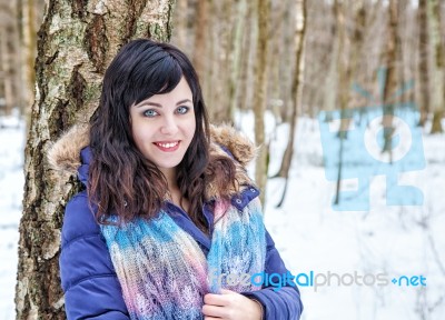 Portrait Of Young Beautiful Woman Walking In The Woods Stock Photo