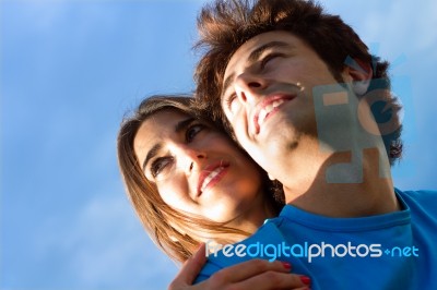 Portrait Of Young Couple Looking At The Horizon Stock Photo