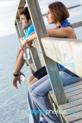 Portrait Of Young Couple Looking At The Horizon Stock Photo