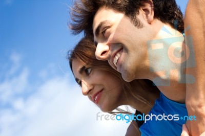 Portrait Of Young Couple Looking At The Horizon Stock Photo