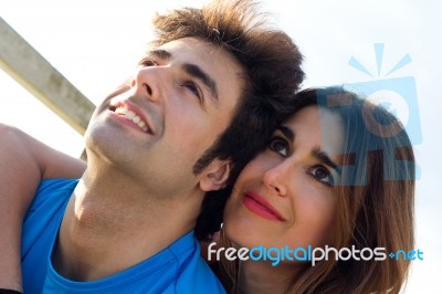 Portrait Of Young Couple Looking At The Horizon Stock Photo