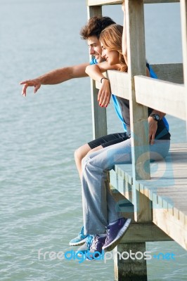 Portrait Of Young Couple Looking At The Horizon Stock Photo