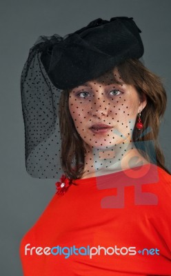 Portrait Of Young Girl In Black Hat With Veil Stock Photo