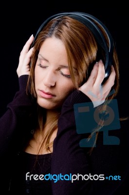 Portrait Of Young Woman Enjoying Music Stock Photo